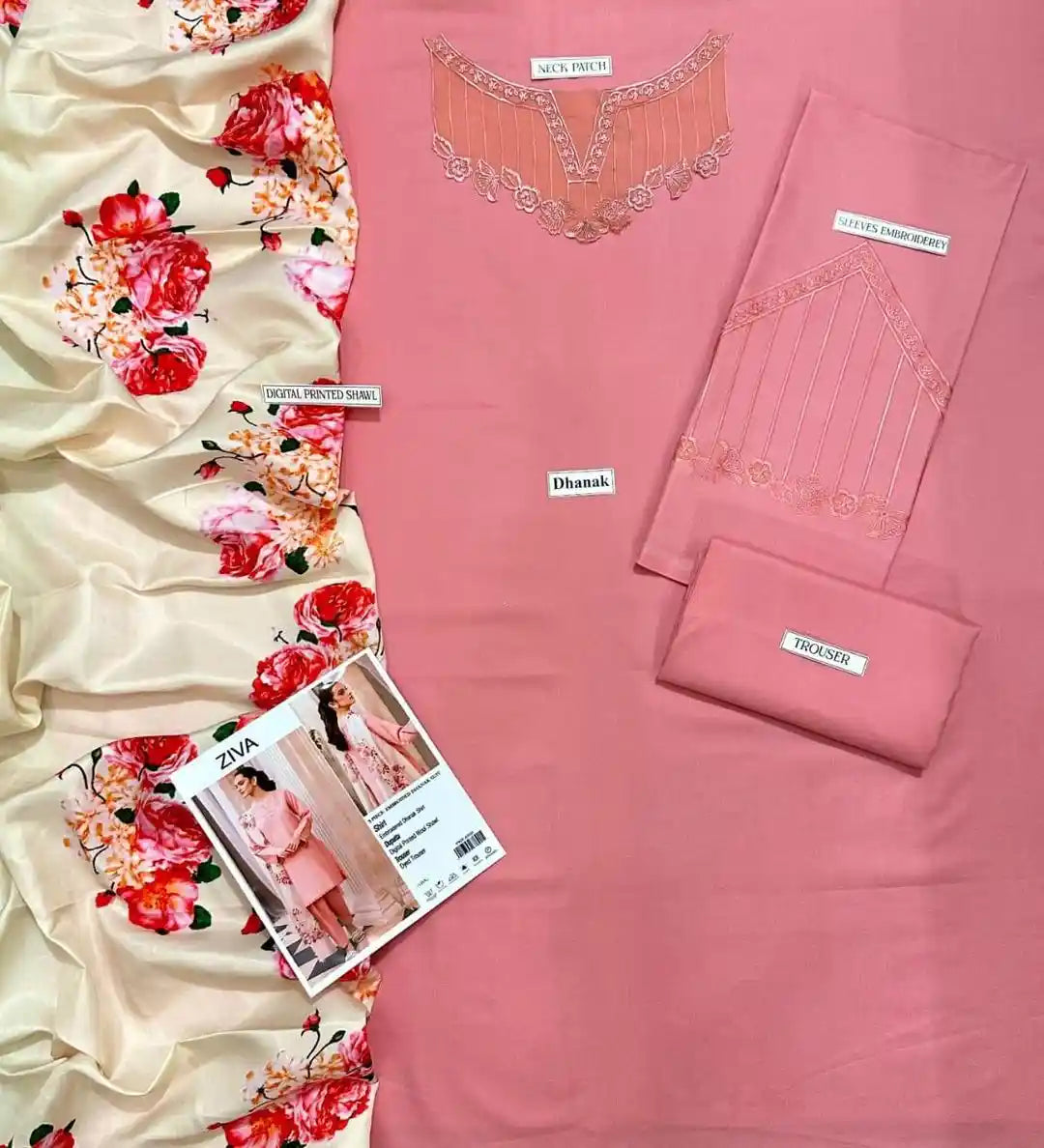 Pink fabric with floral patterns and Zara clothing catalog on a beige background