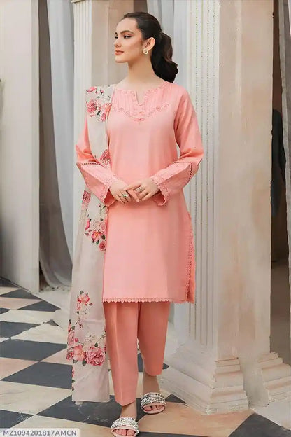 Woman wearing a pink outfit with floral details in an elegant setting.