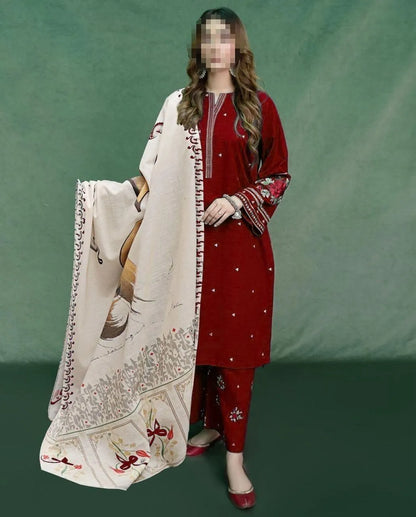 Woman in red traditional outfit holding a white embroidered dupatta against a green background