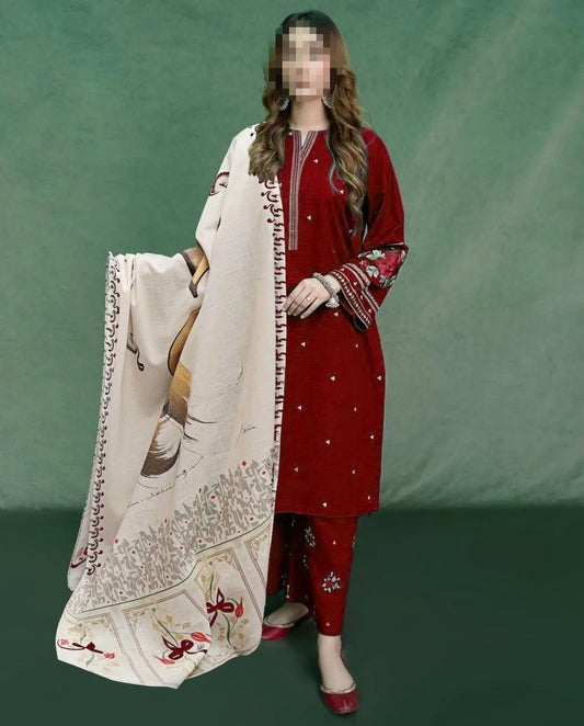 Woman in red traditional outfit holding a white embroidered dupatta against a green background