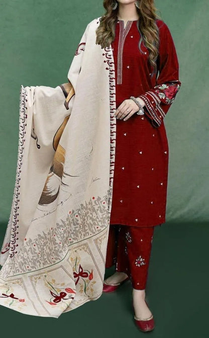 Woman wearing a red traditional outfit with a matching dupatta against a green background